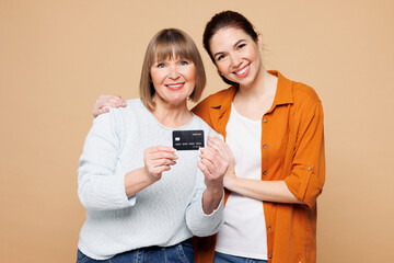 Elder parent mom 50s years old with young adult daughter two women together wear casual clothes...