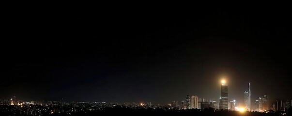 Obraz premium City plunged into total blackout, silhouetted buildings barely visible against the darkened skyline.