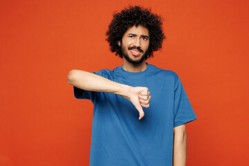 Young sad displeased disappointed man of African American ethnicity he wear blue t-shirt casual...