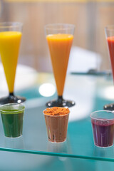 Colorful array of drinks and powders (variety of food colorings) displayed at a festive event
