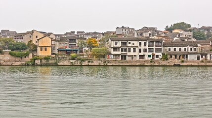 Fototapeta premium Riverfront Chinese village, misty day, tranquil scene, travel tourism