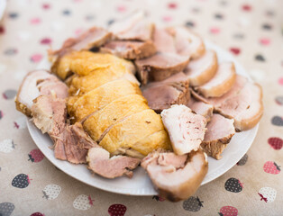 Cold cuts of different types of cooked meat on plate