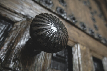 Obraz premium Old Wooden Door with Iron Details