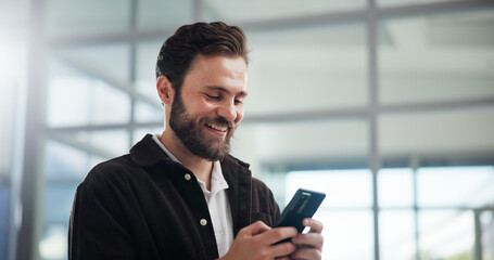 Fototapeta premium Office, businessman and smile with smartphone for chat, online communication and message to contact. Workplace, male person and consultant with happiness for mobile, social media or service to client