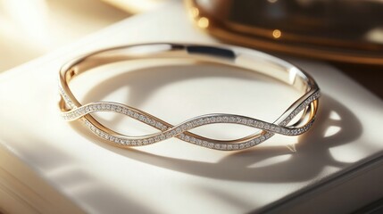 A delicate bracelet featuring a two-tone elegant infinity design, gracefully resting on a bright white surface, symbolizing beauty timeless.