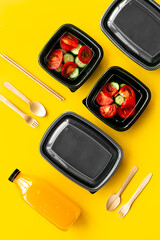 Tomatoes salad in plastic delivery tray, top view. Catering concept