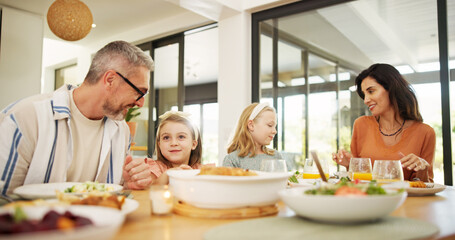 Parents, children and eating food at house for lunch, healthy meal and bonding together. Smile, family and kids at dining table to dish salad for wellness, nutrition and diet vegetables for brunch
