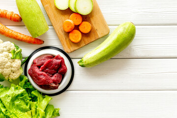 Cooking natural pet food with meat and vegetables, top view