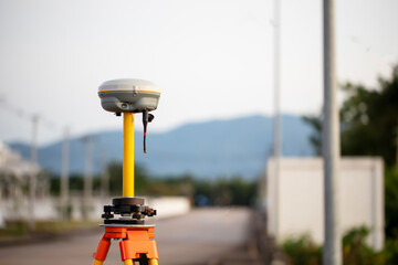 GPS surveying in field blurred of road background, Global Positioning System.