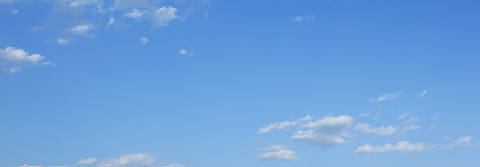 blue sky and fantastic soft white clouds ,  horizontal shape with space for design. Web banner. Wide. Panoramic. Website header