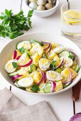 Salad with potatoes, cucumber, onion and eggs. Healthy food. Vegetarian food.