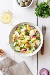 Salad with potatoes, cucumber, onion and eggs. Healthy food. Vegetarian food.