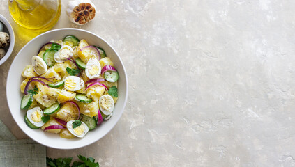 Salad with potatoes, cucumber, onion and eggs. Healthy food. Vegetarian food.