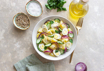 Salad with potatoes, cucumber, onion and eggs. Healthy food. Vegetarian food.