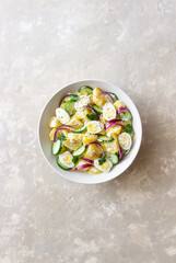 Salad with potatoes, cucumber, onion and eggs. Healthy food. Vegetarian food.