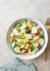 Salad with potatoes, cucumber, onion and eggs. Healthy food. Vegetarian food.