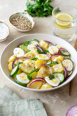 Salad with potatoes, cucumber, onion and eggs. Healthy food. Vegetarian food.