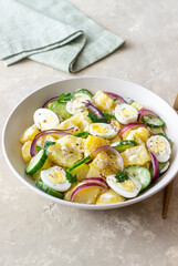 Salad with potatoes, cucumber, onion and eggs. Healthy food. Vegetarian food.
