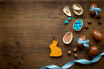 Happy Easter concept. Chocolate eggs with candies,top view