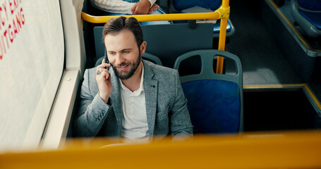 Business, commute and phone call with man on bus for communication or public transport to work. Conversation, journey and travel with happy employee in vehicle for trip as passenger from above