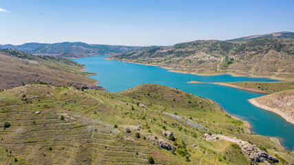 Aerial view of Pusat Dam lake in green valley Halfeti Sivas Turkey