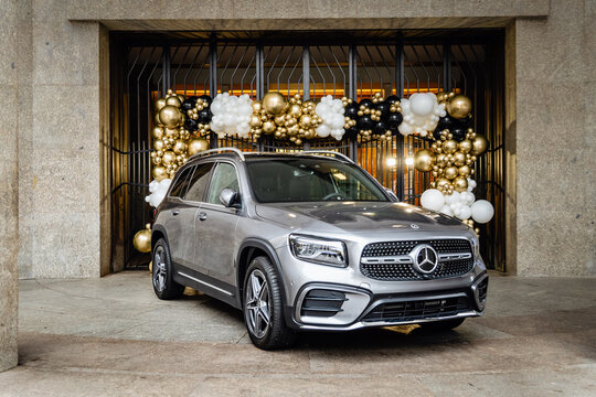 Prague, Czech Republic - October 26, 2024: Silver Mercedes Benz GLB outside on the street in front of a building decorated with balloons for a celebration.