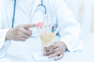 Orthopedist explain to the patient for human hand and fingers bone injury treatment program.Doctor...
