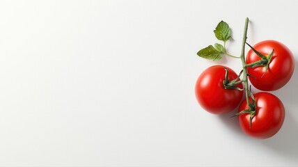 Fresh red tomatoes on a white background, perfect for culinary and healthy eating concepts.