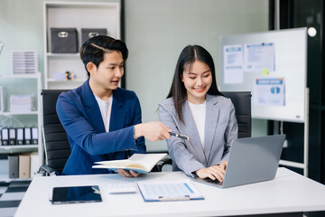 Kind leader executive manager share and discuss business solutions plan ideas on tablet with Asian...