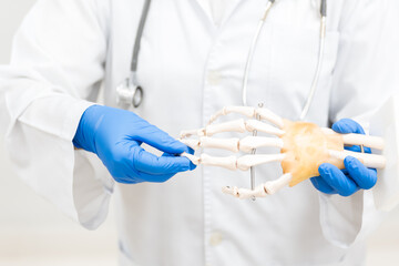 Orthopedist explain to the patient for human hand and fingers bone injury treatment program.Doctor...