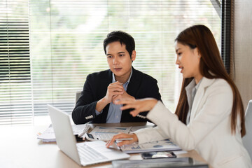 Interactive Business Meeting and Collaboration. Team members engaged in a productive discussion...