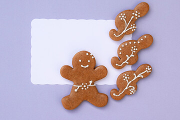Romantic decorated gingerbread cookies in a shape of treble clef and man, white space for text. Musical theme
