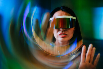 Woman wearing futuristic glasses with neon lights and a surreal prism effect