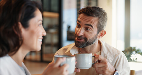 Home, love and couple with coffee, conversation and bonding together in lounge. Care, relax and man with woman, cappuccino and relationship with discussion, romance and happiness with morning or talk