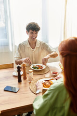 Young couple enjoys a delightful dinner together in their cozy home setting