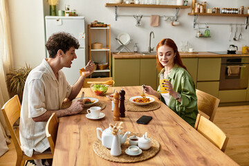 Young couple enjoys delightful moments together at home during a cozy dinner