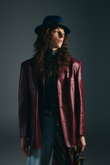 Stylish young man in a vintage leather jacket and hat, showcasing unique fashion flair
