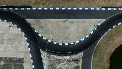 Naklejka premium Asphalt race track with tire mark, Race track for auto racing with car tire skid mark, Car race track asphalt track circuit, Empty curve racetrack car tire mark.