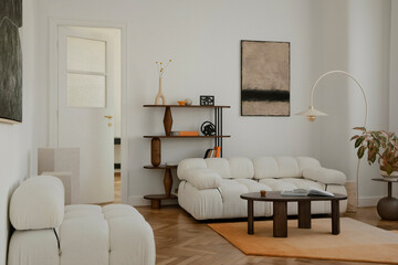 Scandinavian-inspired living room with soft textures, geometric shelving and a cozy minimalist...