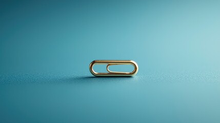 Gold paperclip on teal background
