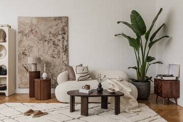 Open book and retro camera on a table in a soft-toned, modern lounge setting.