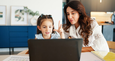 Video call, laptop and mother with child for elearning in home for education, development or growth. Happy, helping and mom with girl kid on computer for online lesson in house together for knowledge