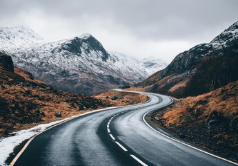 Winding mountain road through snowy landscape
