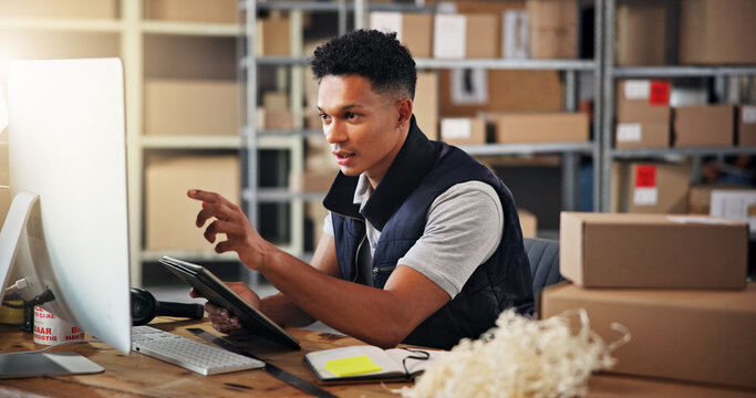 Computer, information and logistics with man in warehouse office for schedule or update. Boxes, pointing and tablet with employee in supply chain depot for delivery, ecommerce or shipping manifest