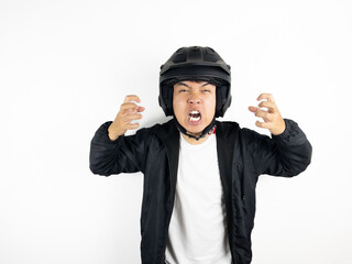 Asian man wearing motorcycle helmet with angry and upset expression on white background