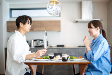 A young Japanese couple enjoying a holiday lunch