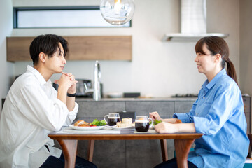 A young Japanese couple enjoying a holiday lunch