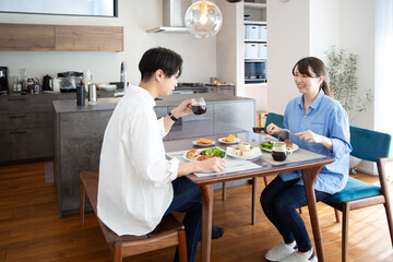 A young Japanese couple enjoying a holiday lunch