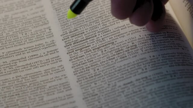 Civil Disobedience Political Dictionary Highlighter Concept, highlighting a word in a dictionary to show it's definition