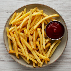 Homemade French Fries and Ketchup on a Plate, top view.